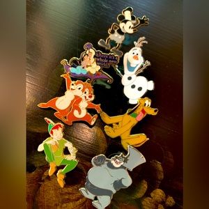 Lot of 7 unique Disney collectible pins.